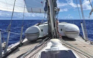 Sailboat with dinghy